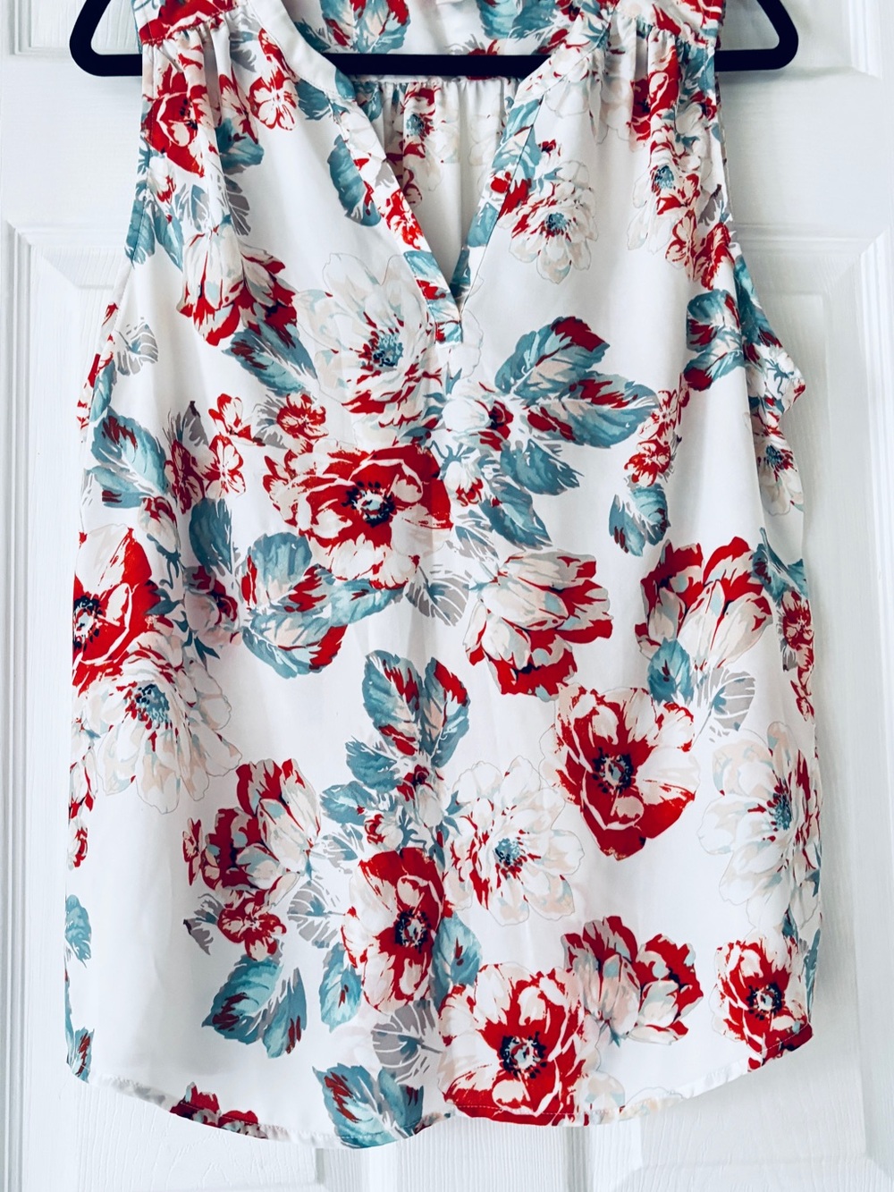Floral V-Neck Sleeveless Camisole in White with Orange & Teal flower print.
